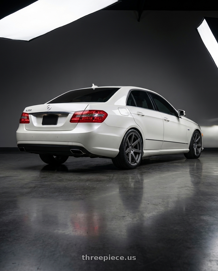 2012 Mercedes-Benz E350 with Rohana RC7 5x112 19x9.5+42 Matte Graphite wheels rear three quarter view square tires