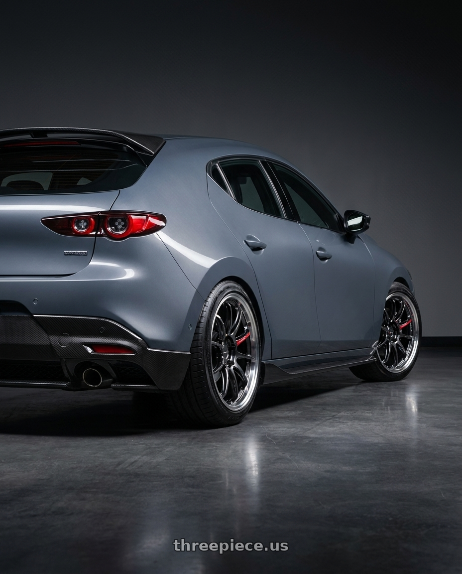2022 mazda3 5d signature carbon packge Polymetal Grey Metallic with Work Emotion Zr10 5x100 18x7.5 +38 Glim Black Diamond Rim cut wheels rear three quarter view slight stretch tires