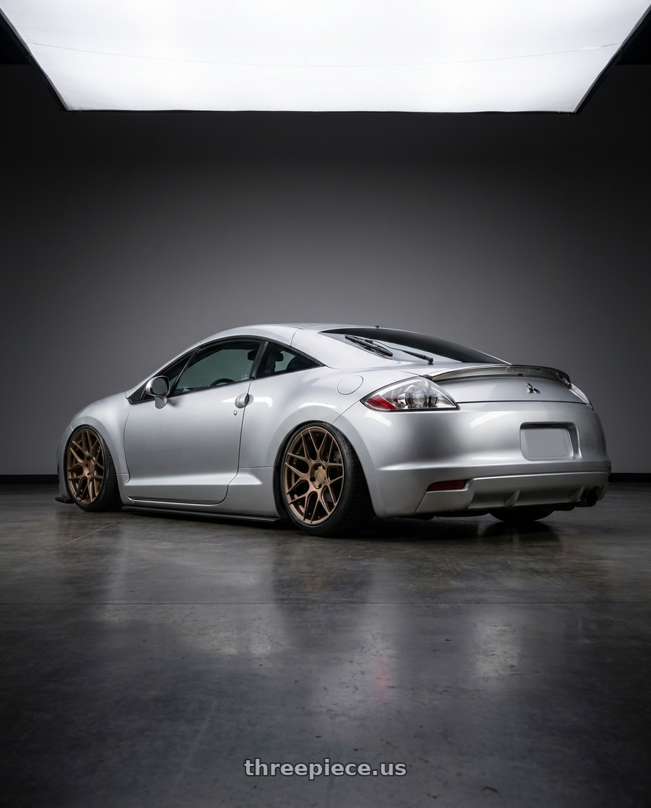 2010 Mitsubishi Eclipse with Aodhan AFF2 5x114.3 19x9.5+35 Matte Bronze wheels rear three quarter view slight stretch tires