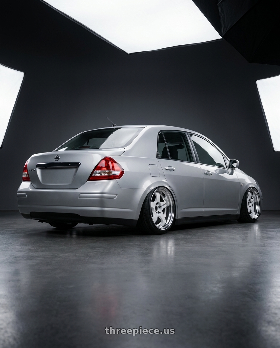 2007 Nissan Tiida with Work Meister S1 2P 4x114.3 15x5.5+38 R Disk White wheels rear three quarter view square tires