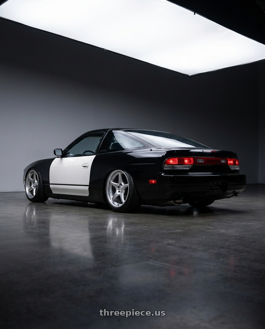 1992 Nissan 240sx Hatchback, Black with white doors and dspec tailights with Kansei K11S Tandem 5x114.3 17x9.5 12 Hyper Silver wheels rear three quarter view slight stretch tires