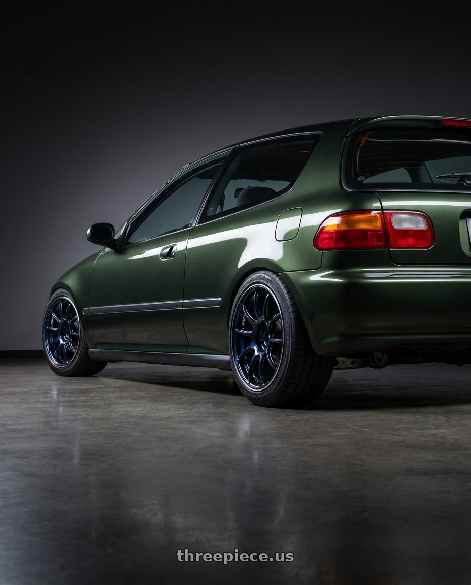 1995 honda civic dx hatchback nori green metalic with Advan Racing RZII 4x100 15x7.0 +42 RACING INDIGO BLUE & RING wheels rear three quarter view square tires