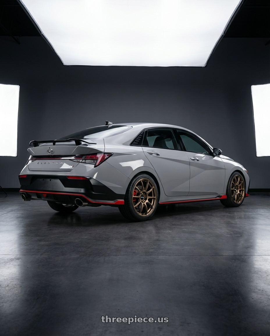 2024 Hyundai Elantra N Cyber Grey Facelift with Advan Racing RZII 5x114.3 18x8.5 +45 RACING BRONZE wheels rear three quarter view square tires