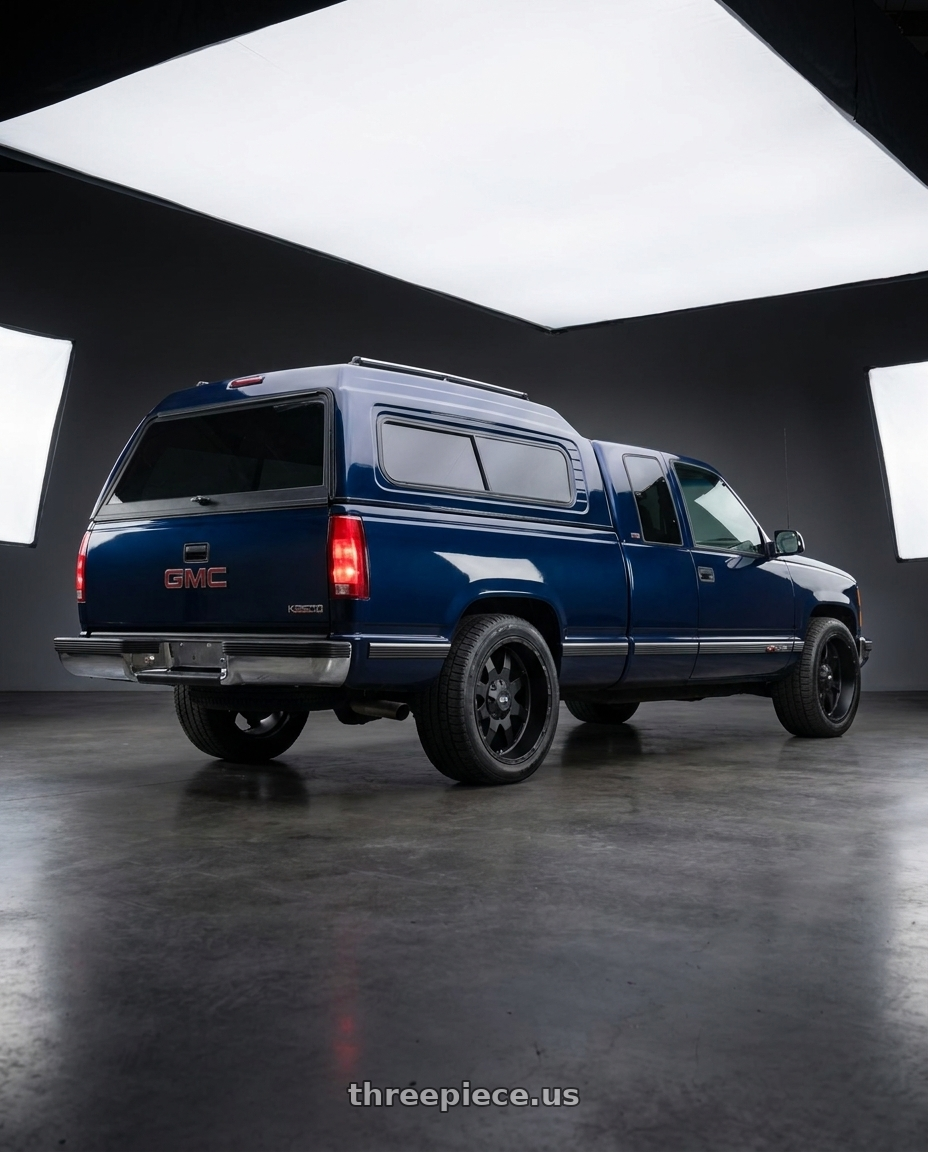 1994 GMC K2500 with G-FX TR-12 8x165.1 17x9+12 Matte Black wheels rear three quarter view square tires