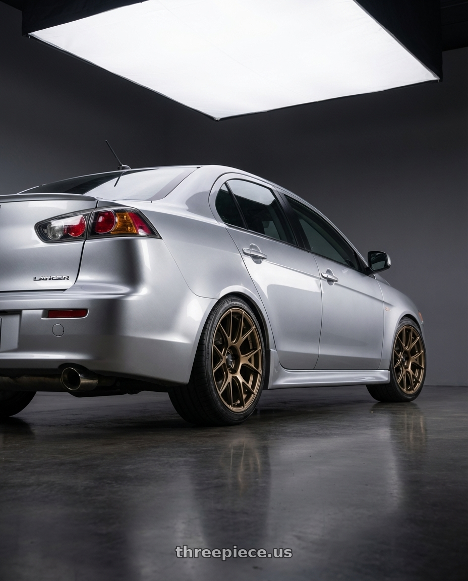 2014 Mitsubishi Lancer Ralliart with Konig Ampliform 5x114.3 18x9.5+35 Gloss Bronze wheels rear three quarter view square tires