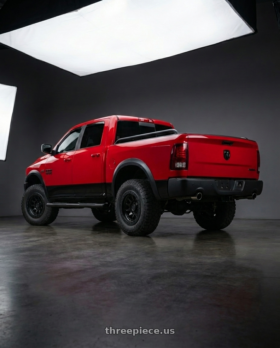2017 RAM 1500 Rebel with Black Rhino BR016 TUSK 5X139.7 17x8.5 -10 GLOSS BLACK wheels rear three quarter view meaty tires