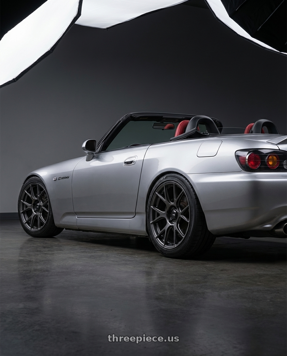 2009 Honda S2000 with Konig Ampliform 5x114.3 17x8+40 Dark Metallic Graphite wheels rear three quarter view square tires