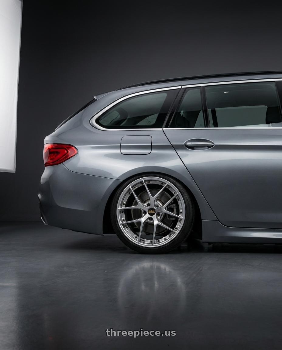 2017 Bmw 520d touring with BBS RI-S 5x112 20x9.0+34 Diamond Silver wheels rear three quarter view slight stretch tires