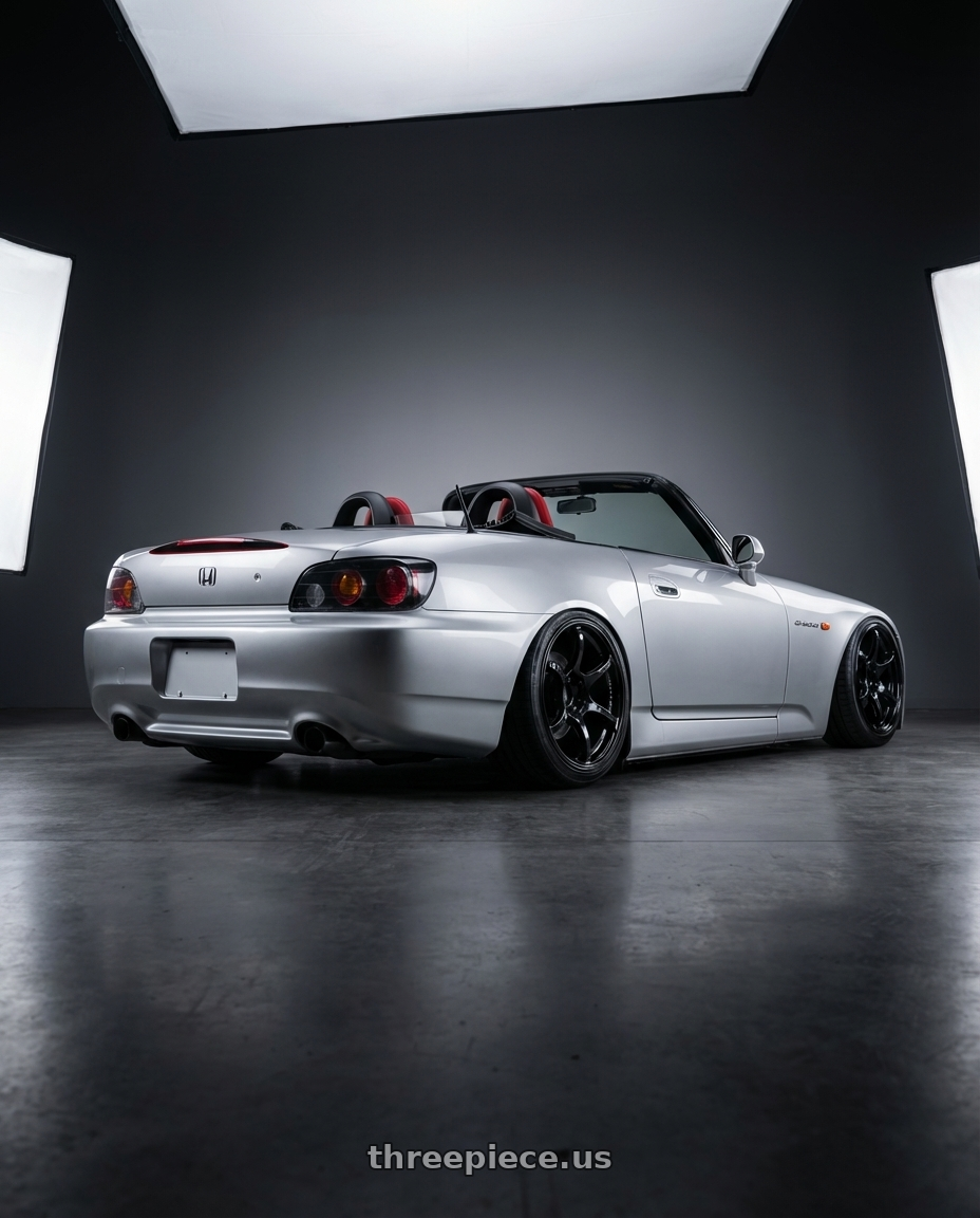 2009 Honda S2000 with Advan RGIII 5x114.3 18x10+35 Gloss Black wheels rear three quarter view slight stretch tires