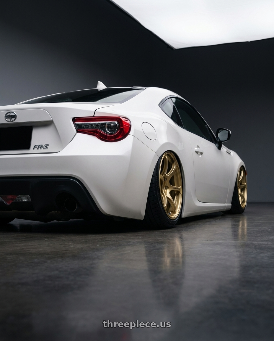 2016 Scion FR-S with Advan RGIII 5x100 17x8.0+48 Gold wheels rear three quarter view slight stretch tires