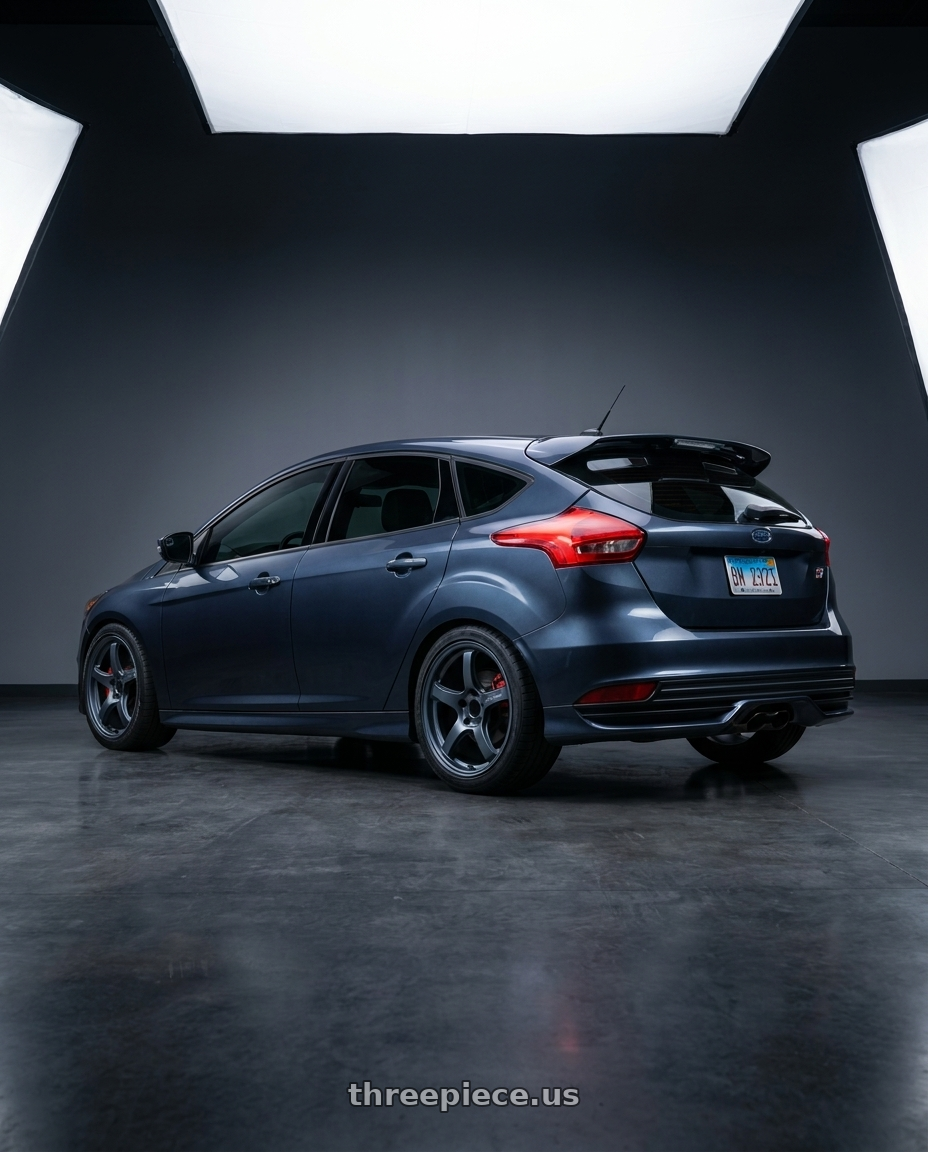 2018 Ford Focus ST with Gram Lights 57CR 5x108 18x8.5 +37 GUNBLUE II wheels rear three quarter view square tires