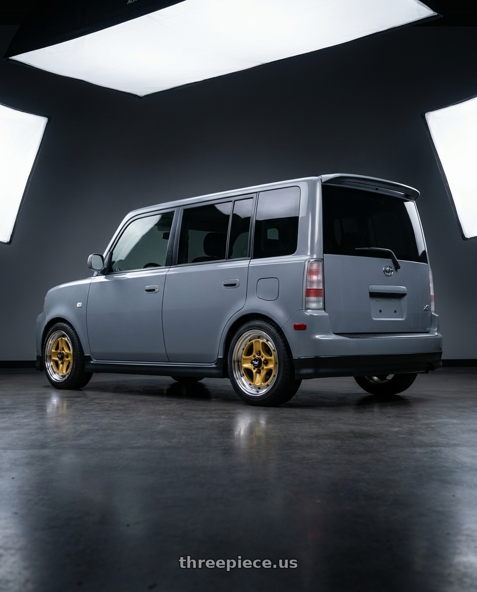2006 Scion xB with Work Equip 40 4x100 15x7 +20 o disk Sprint Gold wheels rear three quarter view square tires