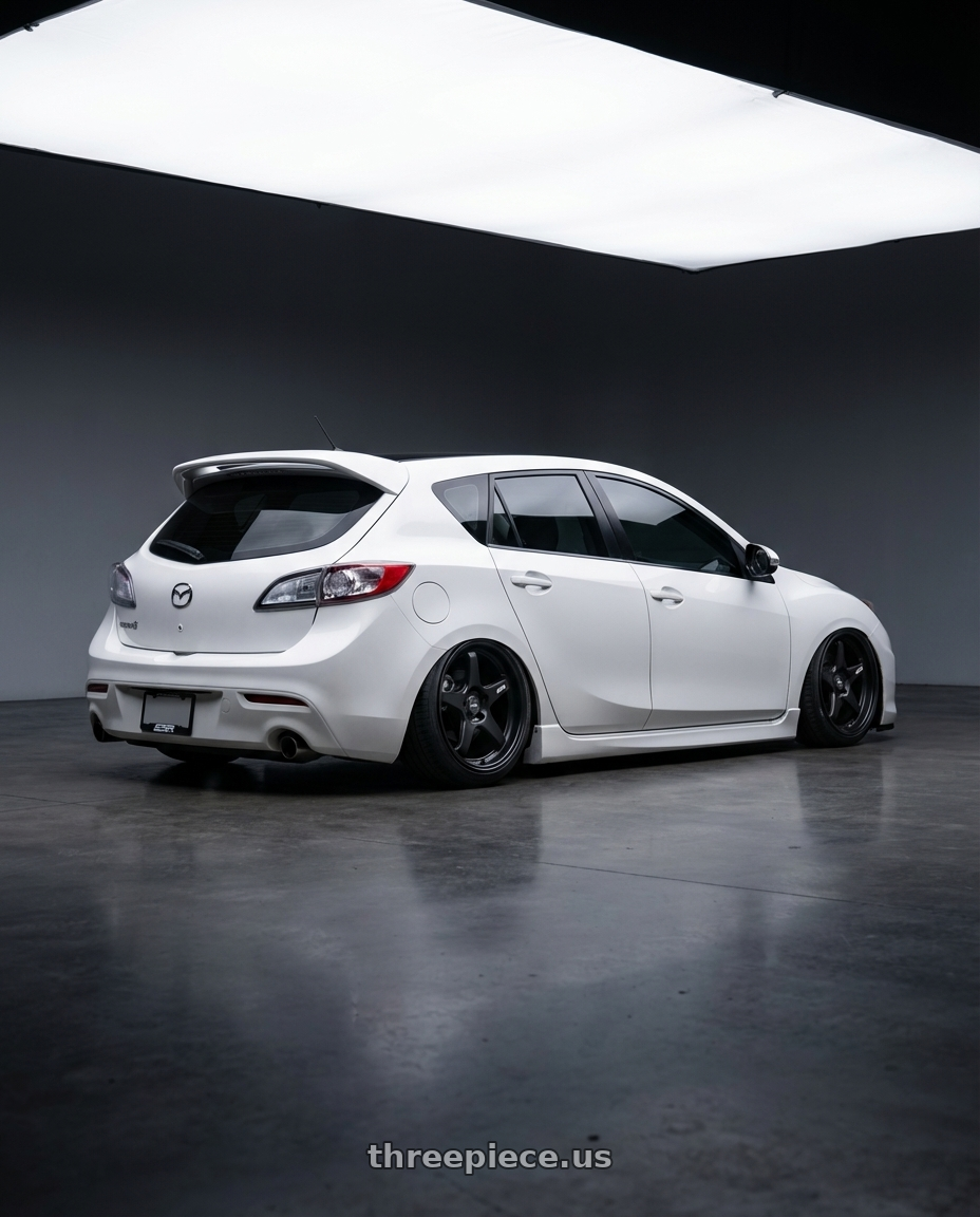 2012 Mazda Mazdaspeed3 with ESR Wheels APEX SERIES AP5 5x114.3 18x9.5 +35 Matte Black wheels rear three quarter view slight stretch tires