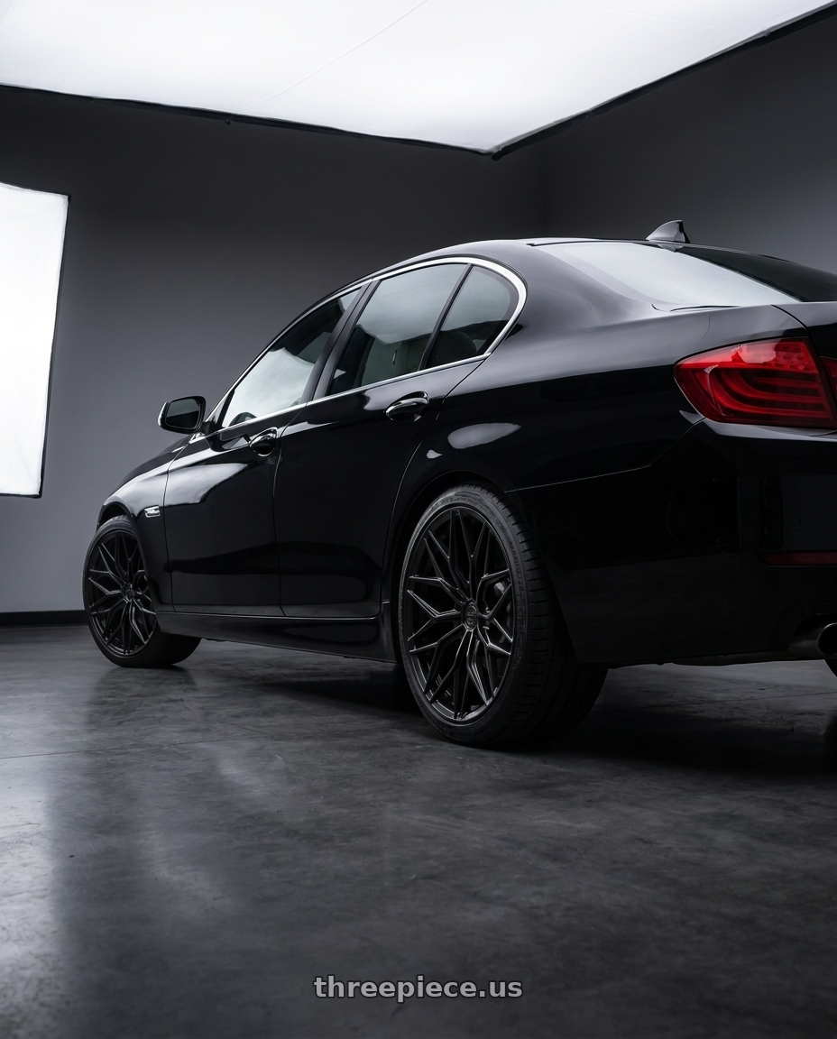 2014 bmw 535i with Brada FR80 5x120 21x11 +35 Satin Black wheels rear three quarter view square tires