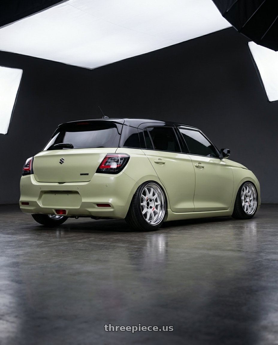 2026 Suzuki swift with Work Emotion Rs11 2p 4x100 16x7 38 white wheels rear three quarter view square tires