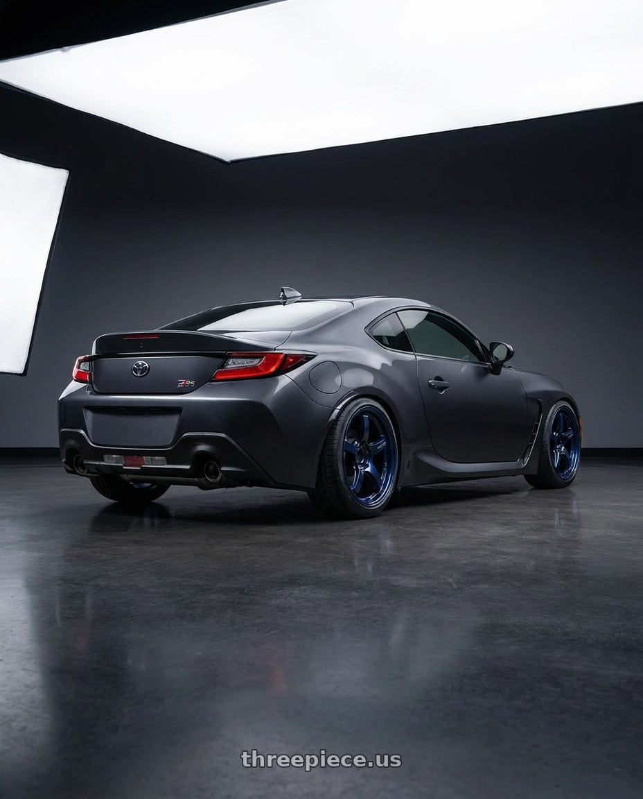 2023 Toyota Gr86 with Gram Lights 57CR 5x100 18x9.5 +38 ETERNAL BLUE PEARL wheels rear three quarter view slight stretch tires