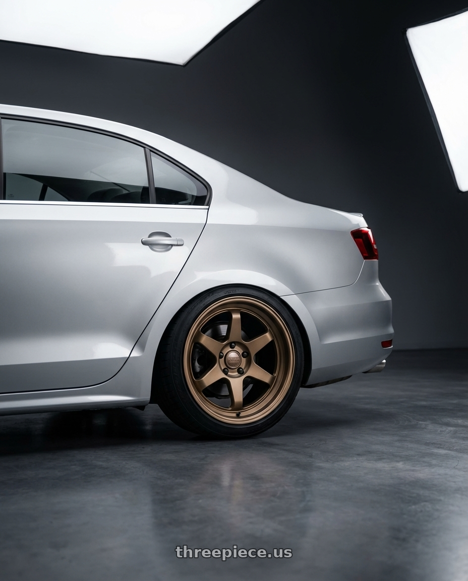 2016 Volkswagen Jetta GLI MK6 with Kansei K11B Tandem 5X112 18x8.5 35 Bronze wheels rear three quarter view square tires