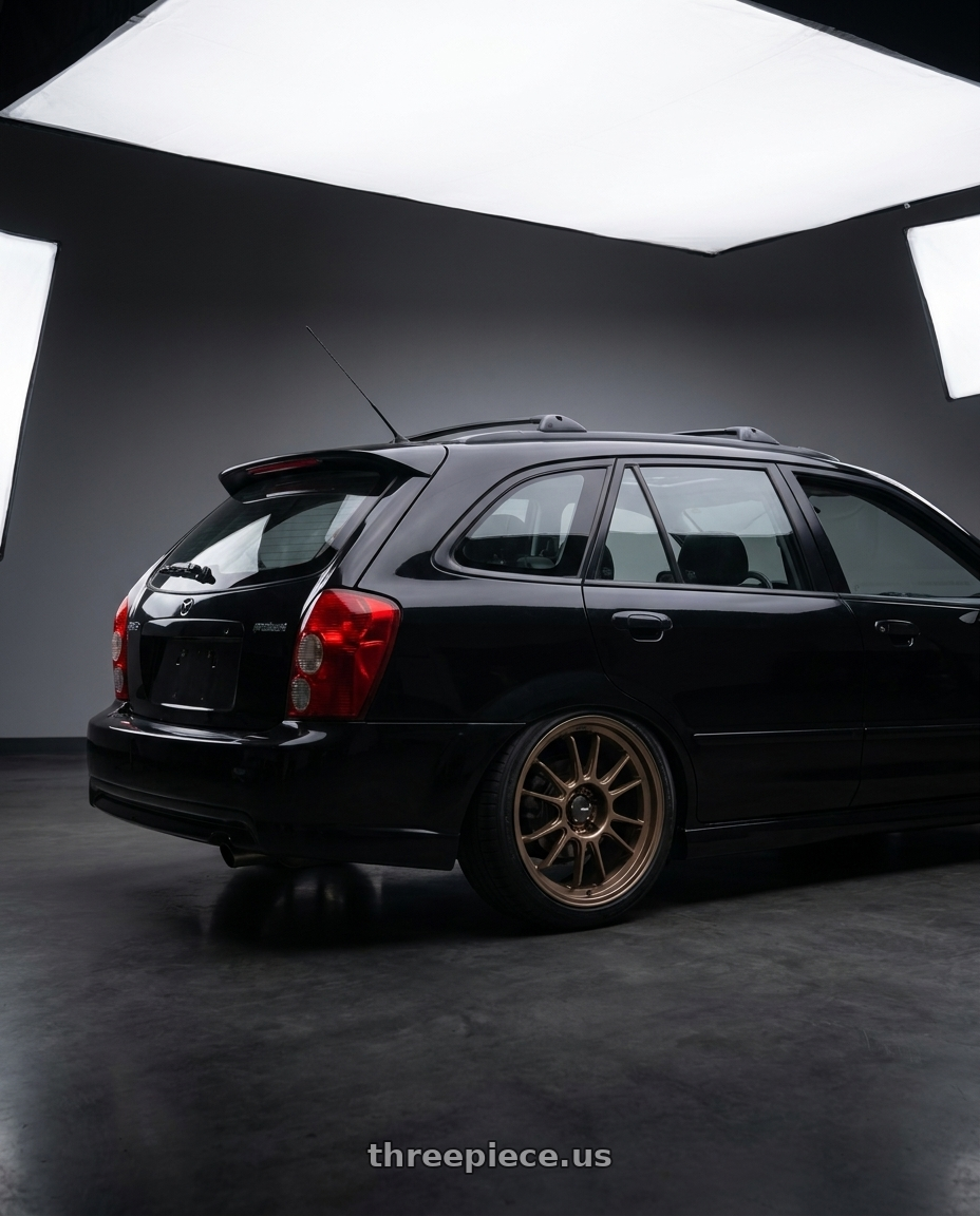 2002 Mazda Protege5 with Konig Hypergram 5x114.3 16x7.5+38 Race Bronze wheels rear three quarter view square tires