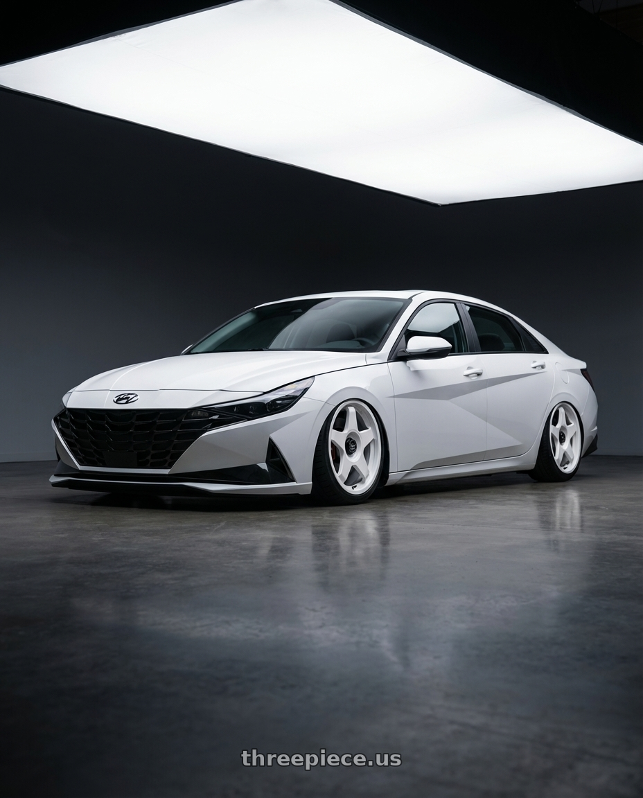 2024 Hyundai Elantra N with fifteen52 CHICANE 5x114.3 / 5x120 19x8.5 +35 RALLY WHITE (GLOSS WHITE) wheels front three quarter view stanced stance