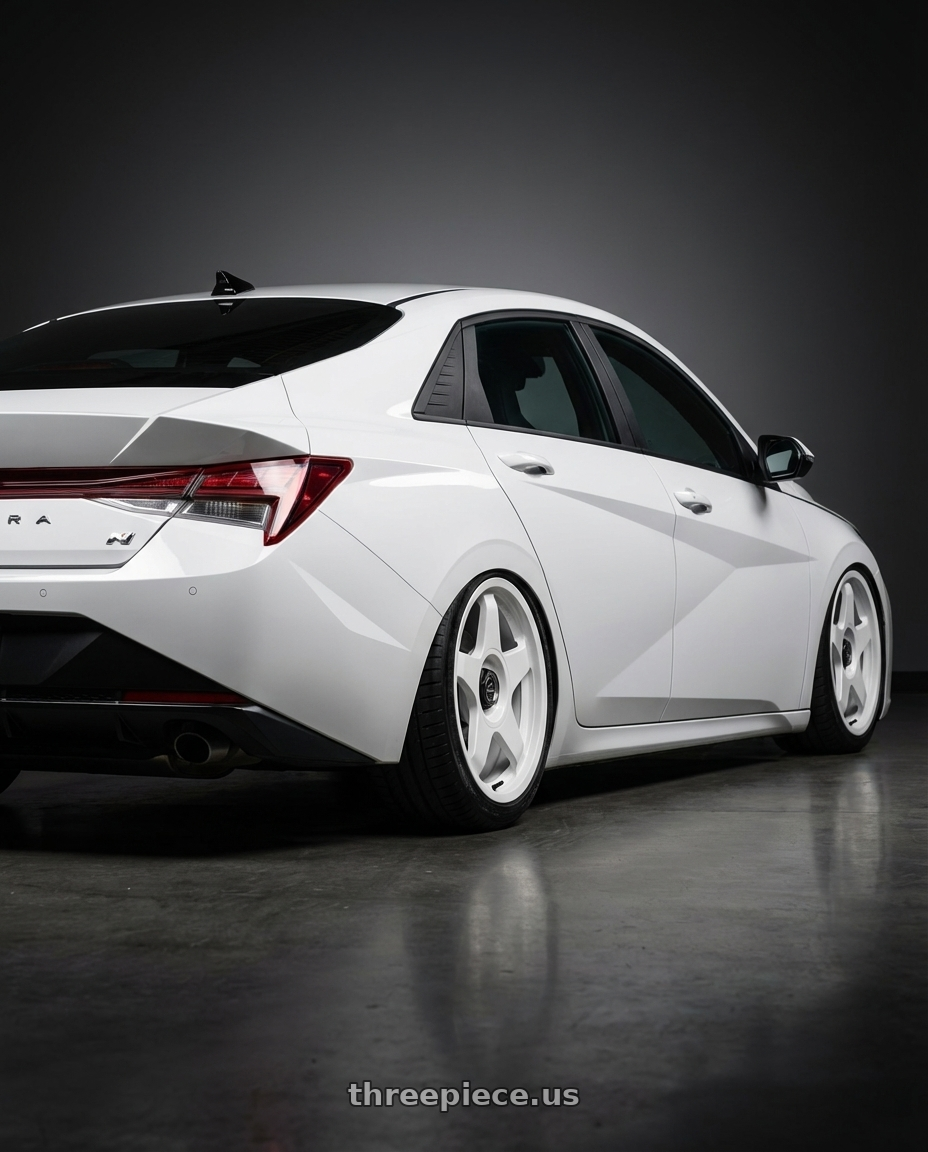 2024 Hyundai Elantra N with fifteen52 CHICANE 5x114.3 / 5x120 19x8.5 +35 RALLY WHITE (GLOSS WHITE) wheels rear three quarter view slight stretch tires