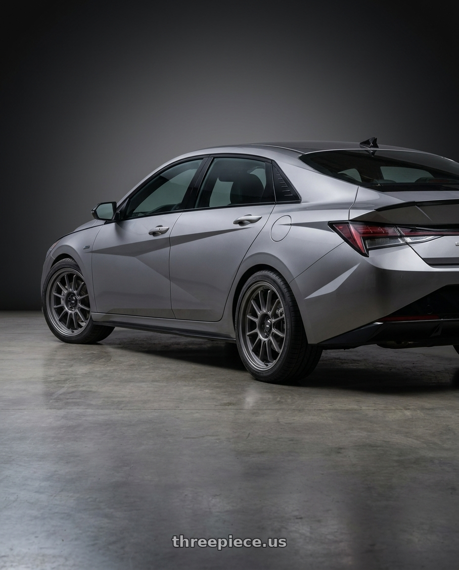2023 Hyundai Elantra n line with Konig Hypergram 5x114.3 17x8+45 Matte Grey wheels rear three quarter view square tires
