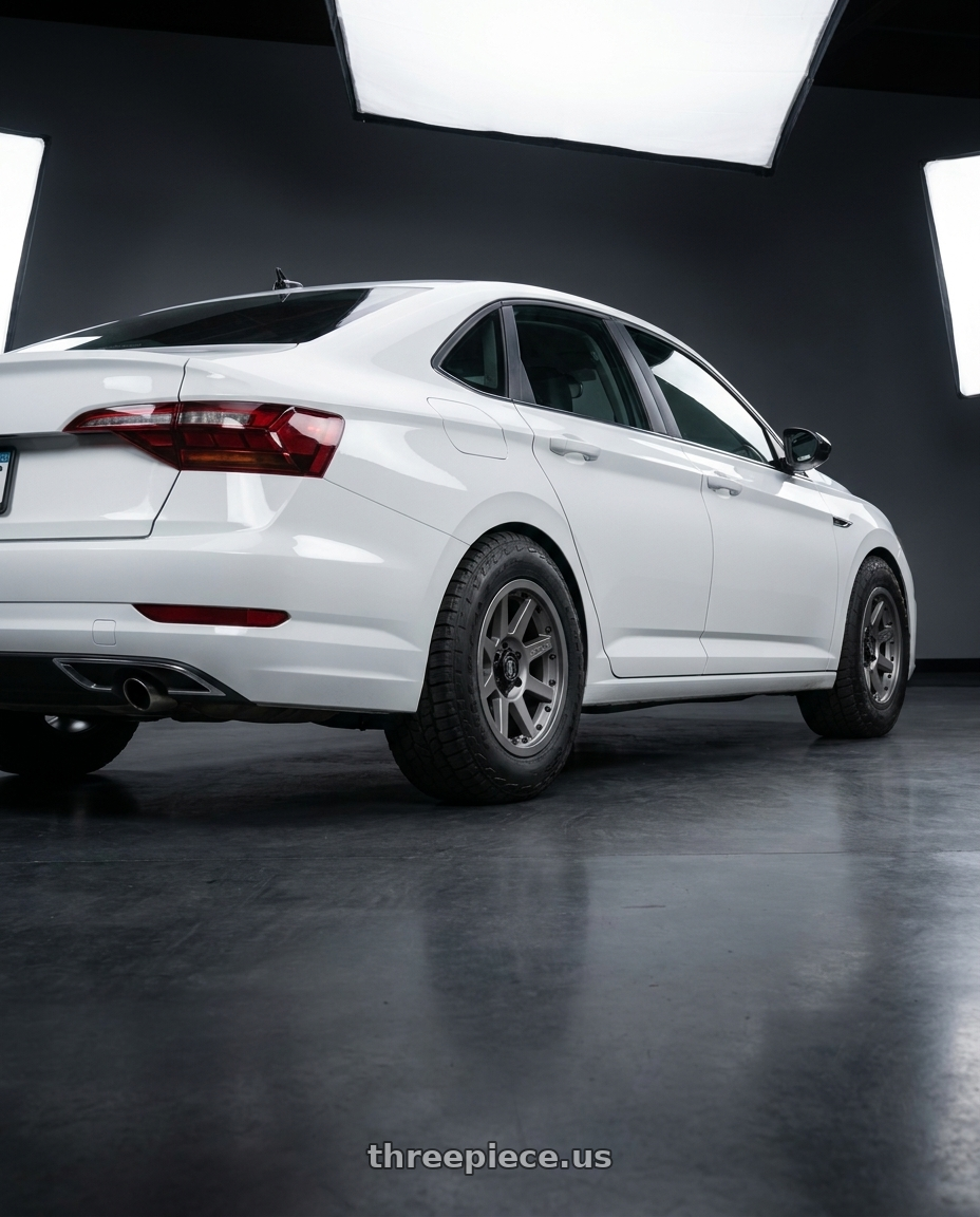 2026 vw jetta with Icon Alloys REBOUND PRO 5x150 17x8.5+25 TITANIUM wheels rear three quarter view meaty tires