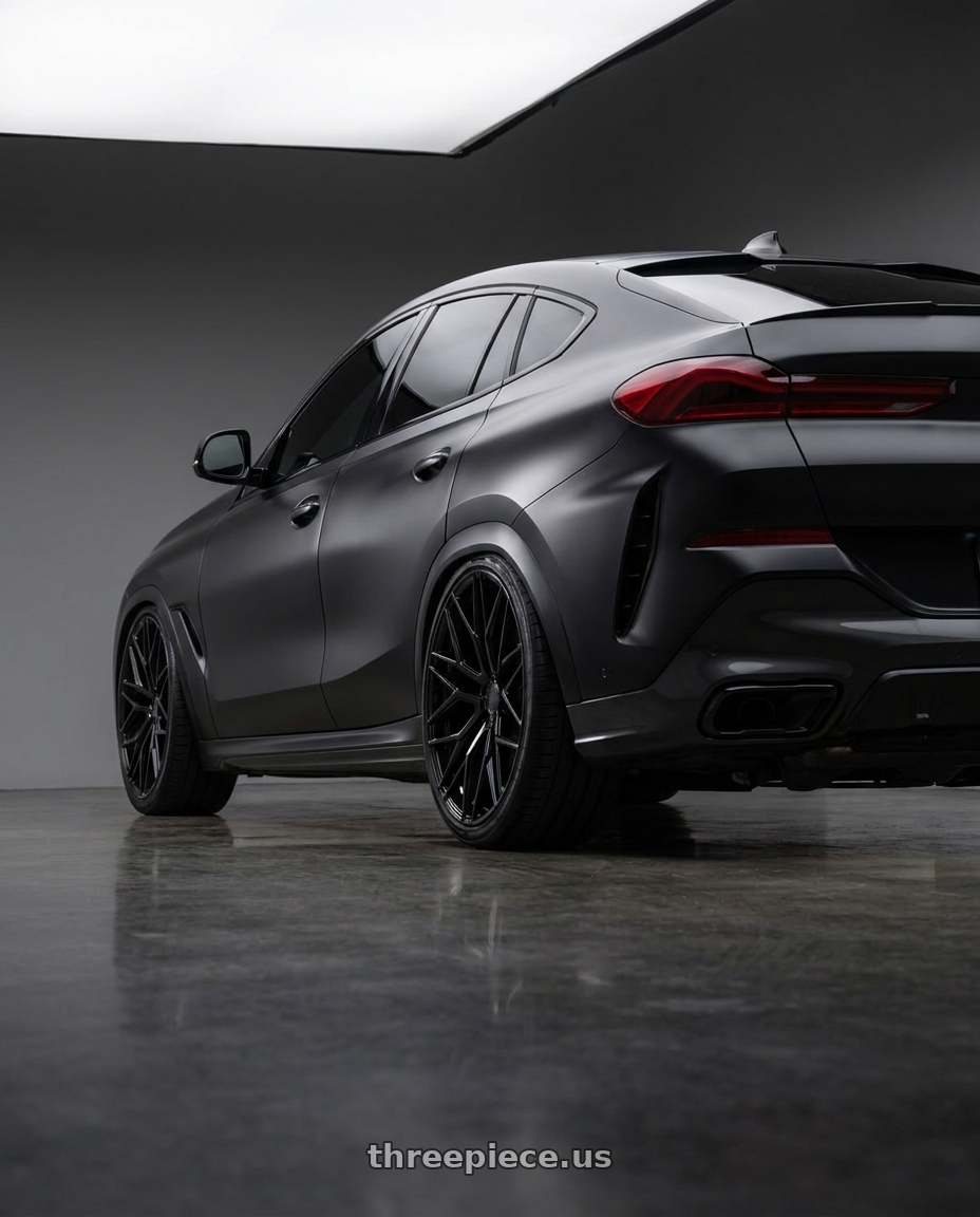 2025 BMW X6 with Avant Garde Wheels M520R 5X112 22x10.5 +38 Gloss Black wheels rear three quarter view extreme stretch tires