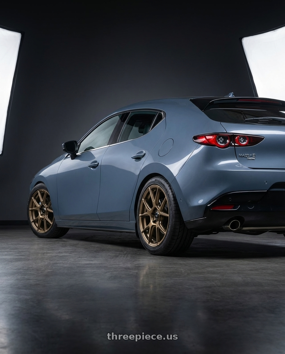 2023 Mazda Mazda3 Turbo with Konig Ampliform 5x114.3 18x9.5+25 Gloss Bronze wheels rear three quarter view square tires