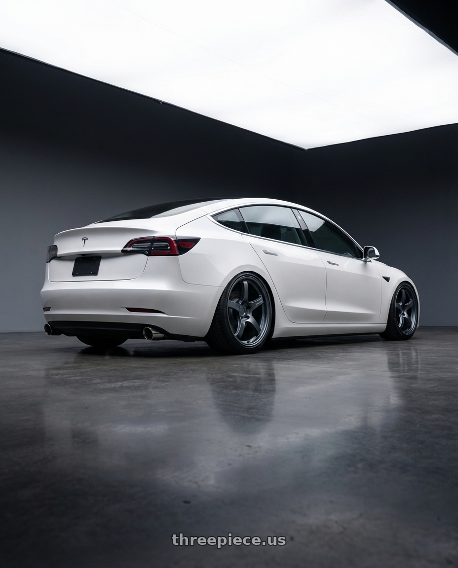 2023 Tesla Model 3 with Gram Lights 57CR 5x114.3 19x9.5+25 Gunblue II wheels rear three quarter view slight stretch tires