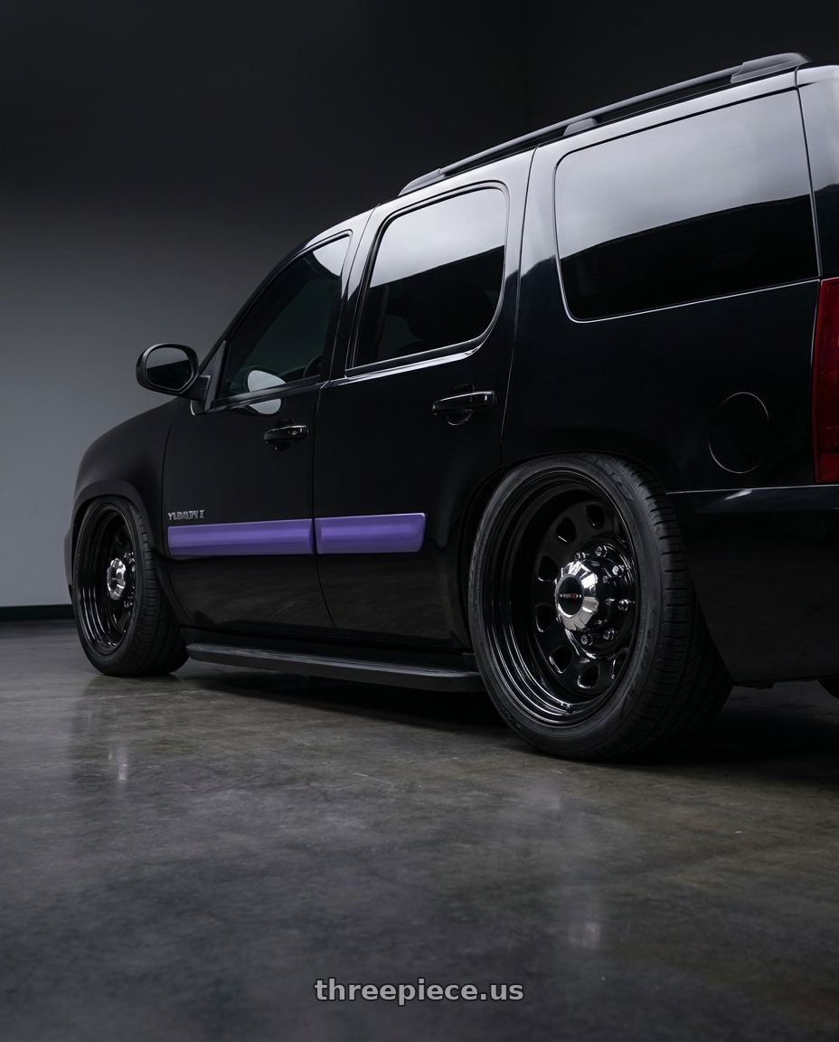 2007 gmc Yukon with Vision HD 84H 6x139.7 16x8-12 Gloss Black wheels rear three quarter view slight stretch tires