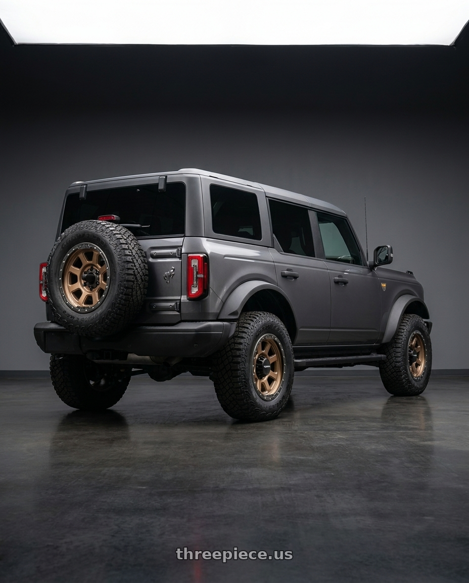 2023 Ford Bronco Badlands with Vision Off-Road 350 Ojos 6x139.7 17x9+12 Bronze wheels rear three quarter view square tires