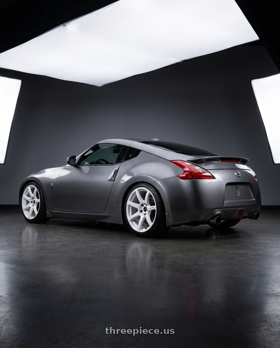 2009 Nissan 370z with Work Emotion T7r 5x100 19x10.5 +12 White wheels rear three quarter view slight stretch tires