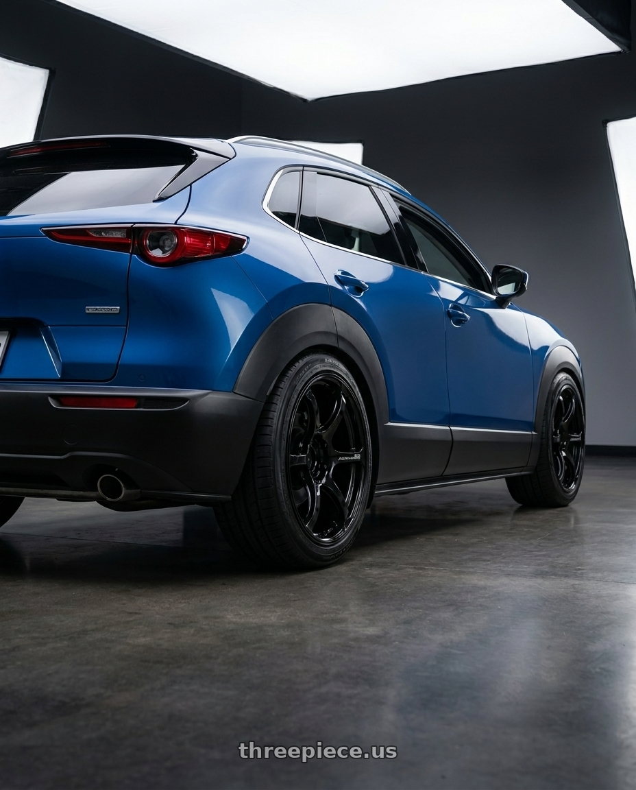 2020 Mazda Cx30 with Advan RGIII 5x114.3 18x10.5+25 Gloss Black wheels rear three quarter view square tires