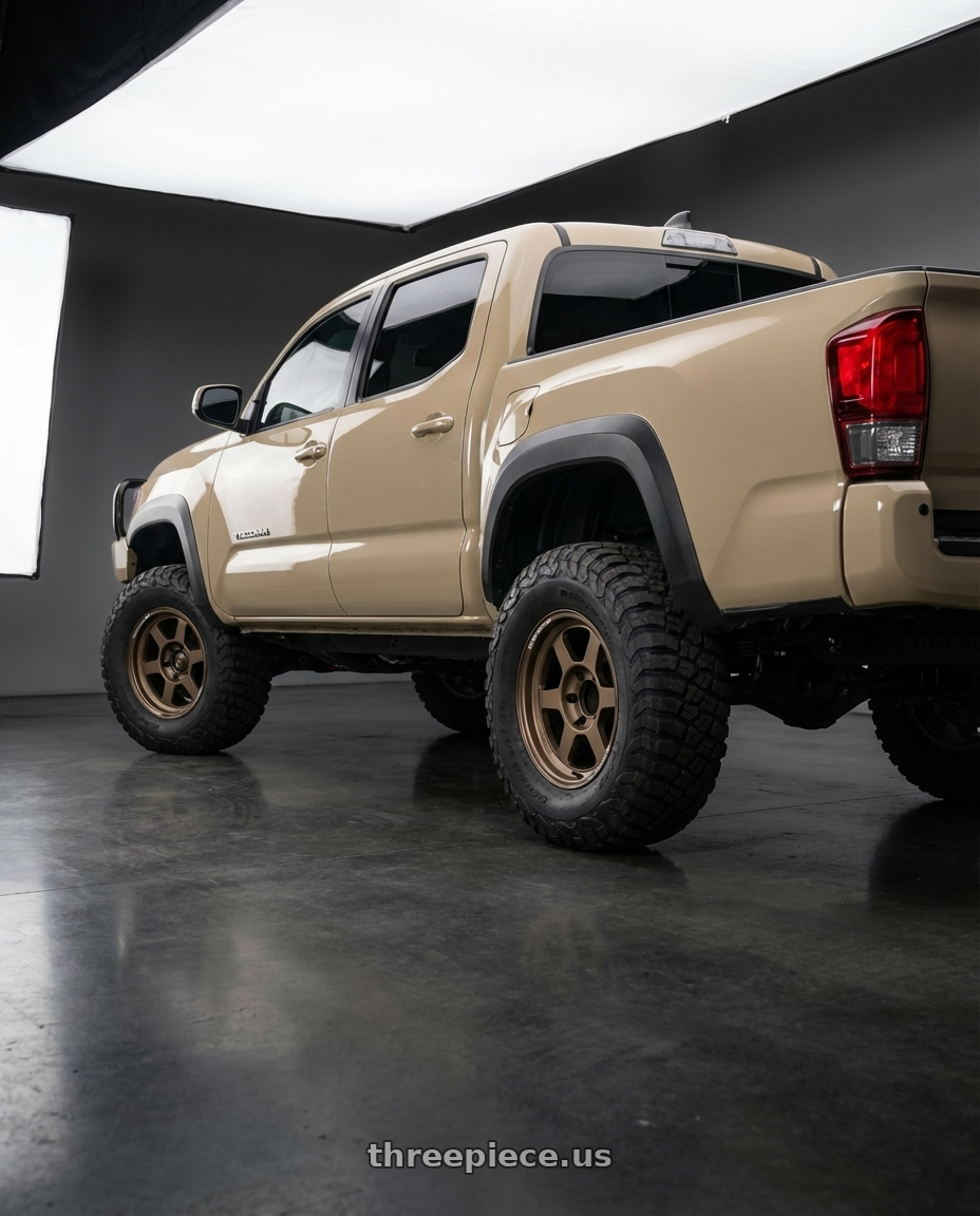 2018 Toyota Tacoma  with Volk Racing TE37XT M-Spec 6x139.7 16x8.0 0 Bronze Almite wheels rear three quarter view meaty tires