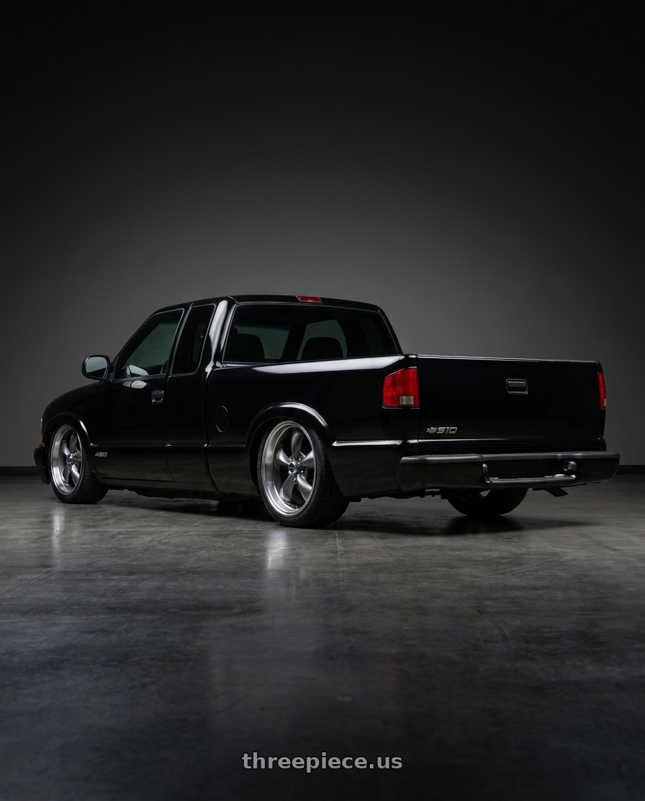 1999 Chevy S10 with American Racing AR105 TORQ THRUST M 5X114.3 17X8 0 ANTHRACITE W/ MACHINED LIP wheels rear three quarter view square tires
