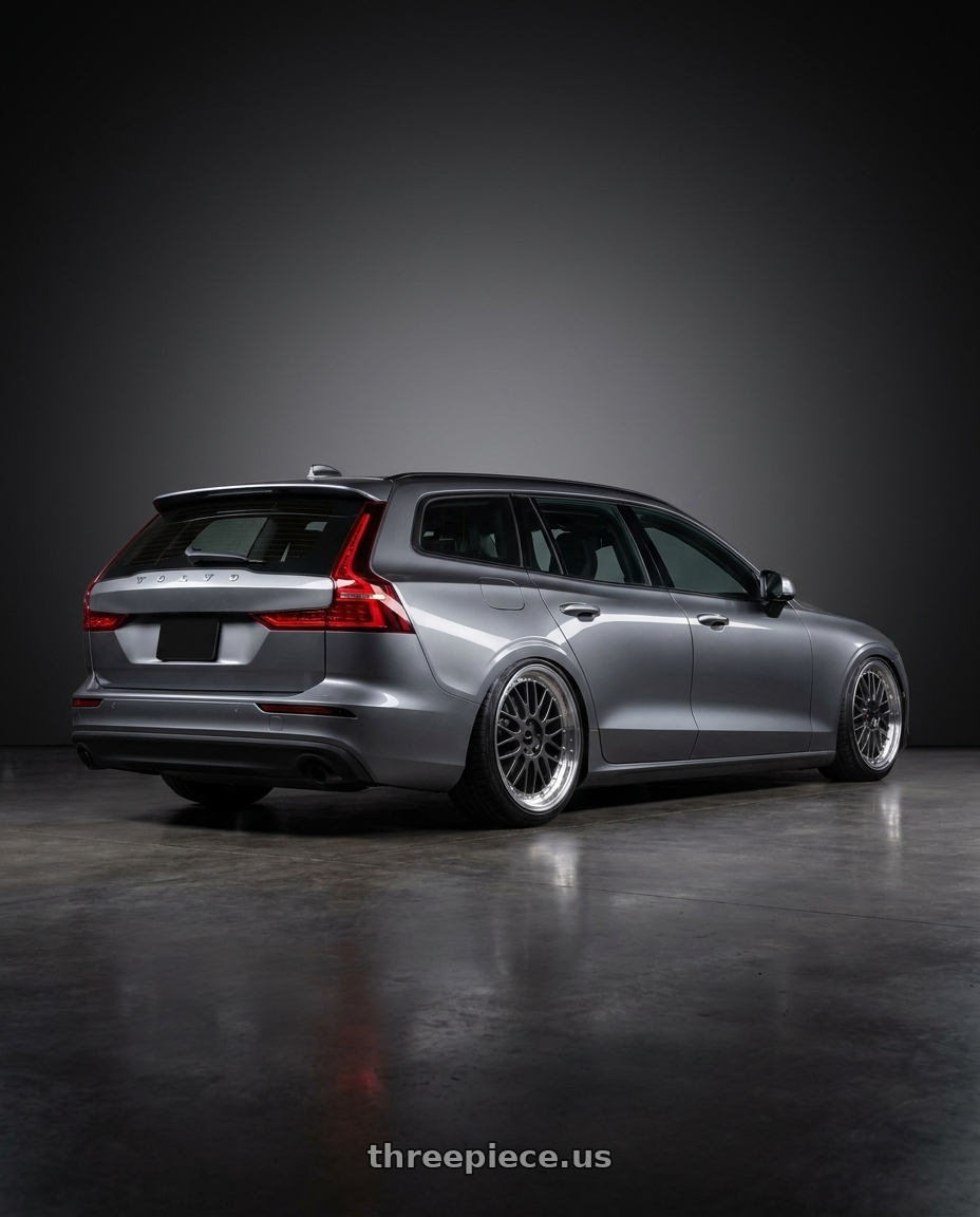 2018 Volvo V60 with Vors VR8 5x108 20x9.5  +35 Hyper Black Machine Lip Chrome Rivet wheels rear three quarter view slight stretch tires