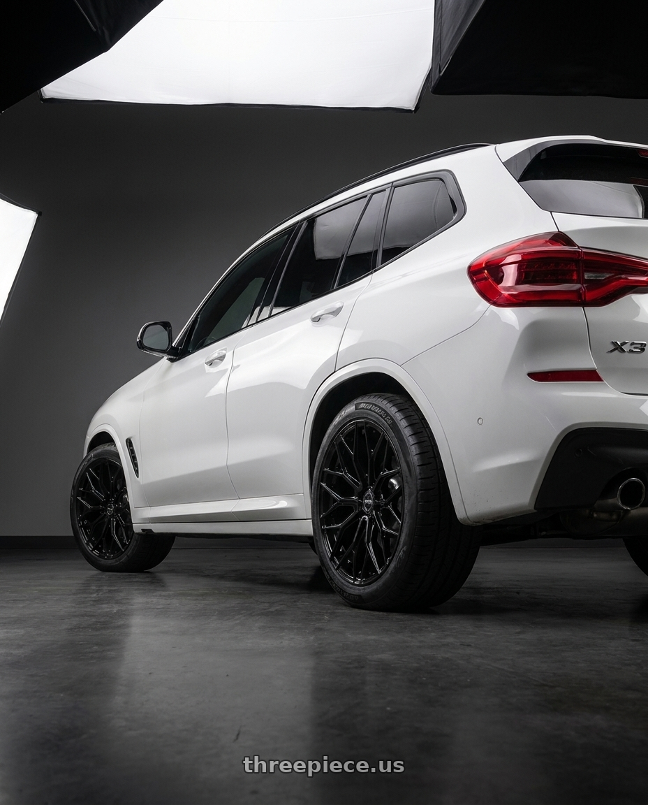 2019 BMW X3 with F1R FS3 5x112 20x9 +35 Gloss Black wheels rear three quarter view meaty tires