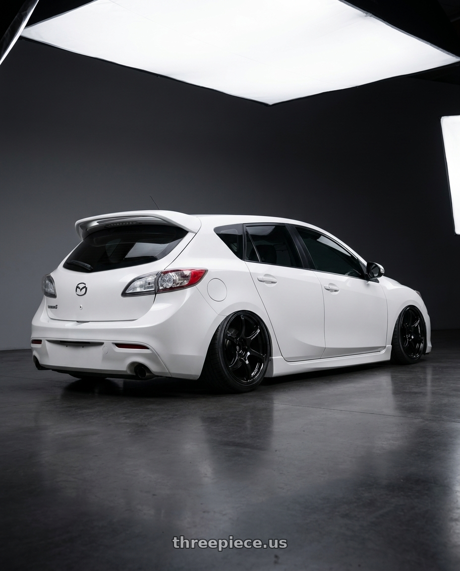 2012 Mazda Mazdaspeed3 with Advan RGIII 5x114.3 18x8.0+37 Gloss Black wheels rear three quarter view slight stretch tires