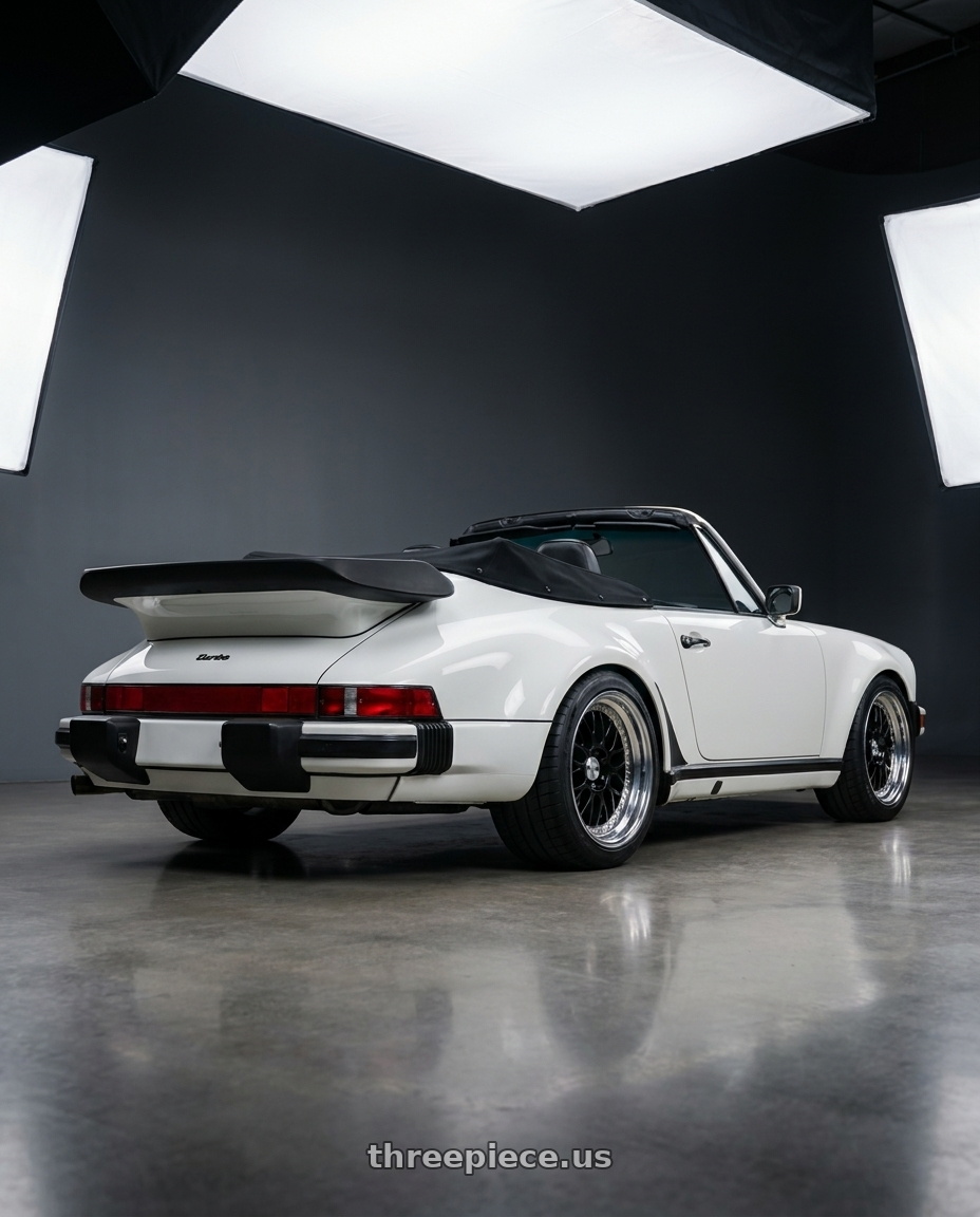 1987 Porsche 930 with Work Meister M1 3p 5x130 18x10+15 H Disk Black wheels rear three quarter view square tires