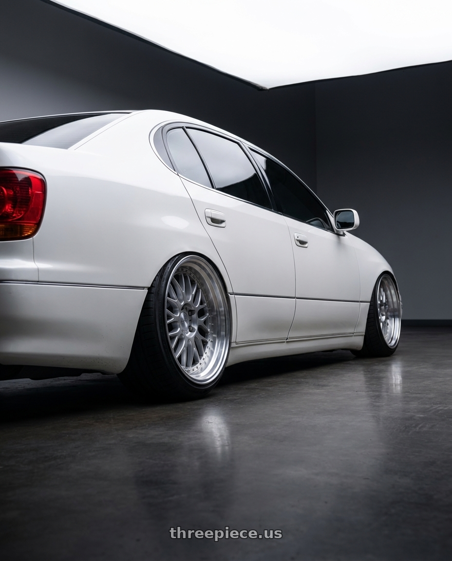 2001 Lexus GS300 with Work Emotion T7r 5x114.3 18x10.5 +12 Gt Silver wheels rear three quarter view slight stretch tires