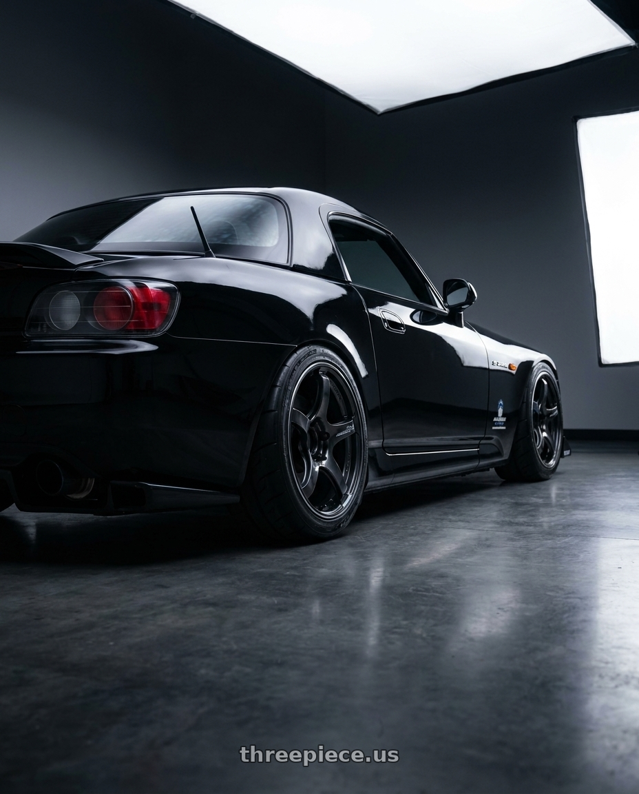 2000 Honda S2000 with Advan Racing TC4 5x114.3 17x9.5 +50 BLACK GUNMETALLIC & RING wheels rear three quarter view square tires