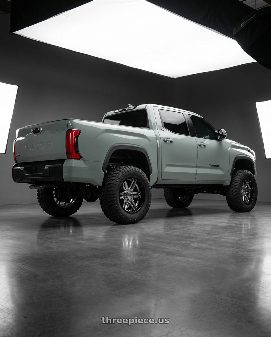 2024 Toyota Tundra with Moto Metal MO202 6X139.7 22X10 -18 CHROME CENTER GLOSS BLACK MILLED LIP wheels rear three quarter view meaty tires