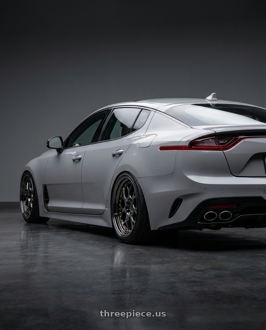 2023 Kia stinger gt2 with Aodhan DS01 5x114.3 18x8.5+35 Black Vacuum W/ Gold Rivets wheels rear three quarter view square tires