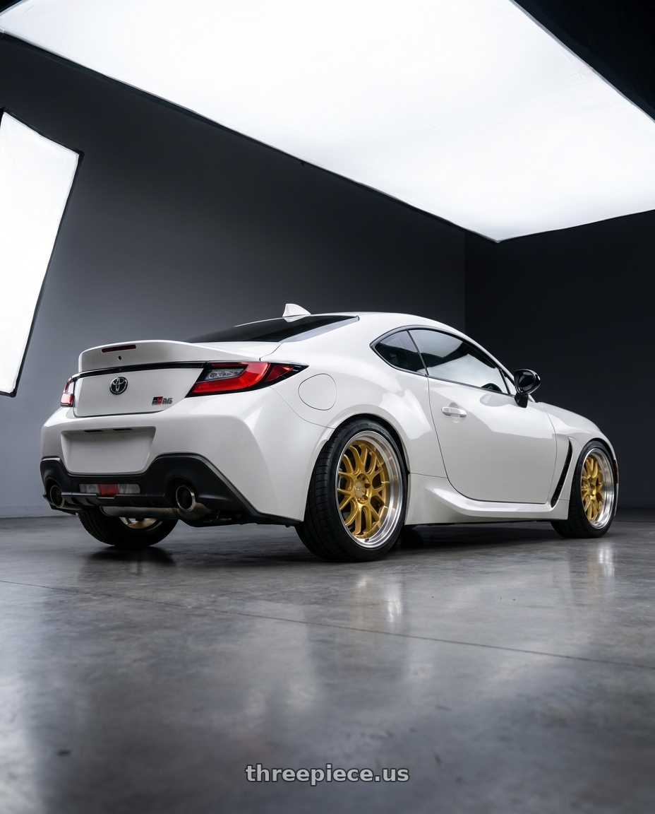 2026 Toyota gr86 with F1R F21 5x100/5x114.3 18x8.5 +38 Machine Gold/Polish Lip v2 wheels rear three quarter view square tires