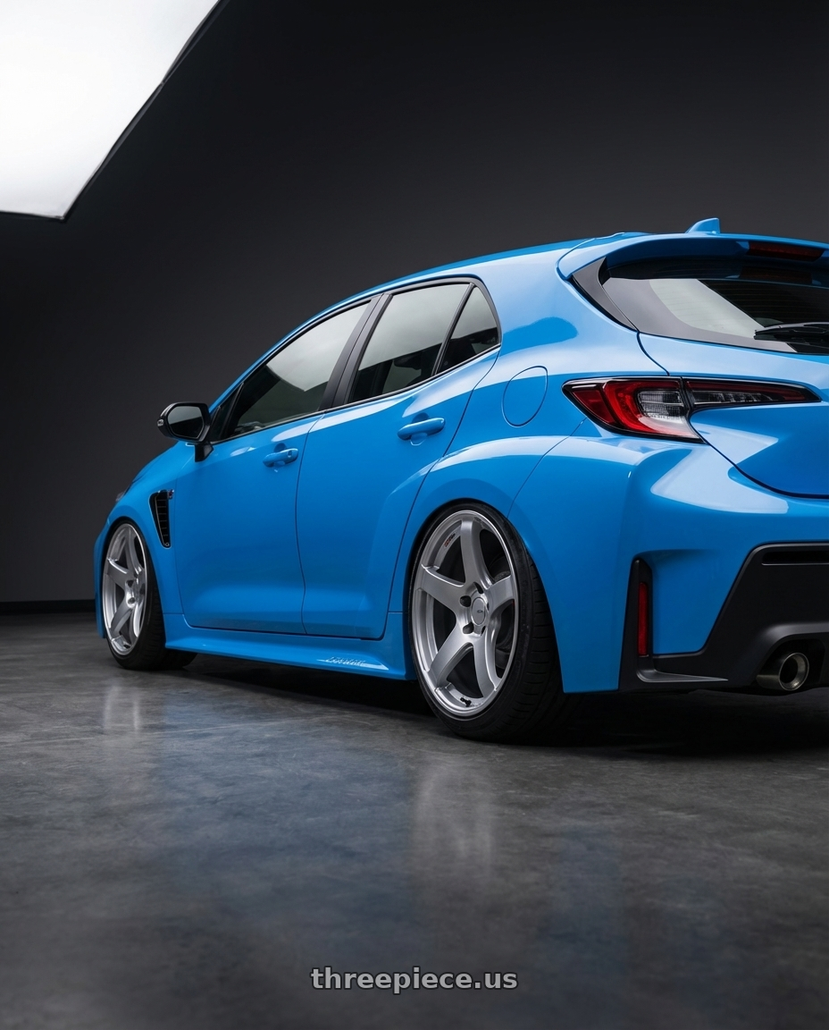 2024 Toyota GR Corolla with Ssr Gtv01 5x114.3 18x10.5+15  GLARE SILVER wheels rear three quarter view slight stretch tires