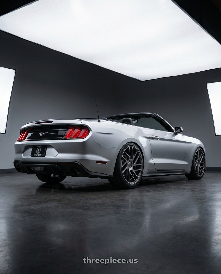 2018 ford mustang with Status JUGGERNAUT 5X114.3 20X9 +30 CARBON GRAPHITE wheels rear three quarter view slight stretch tires