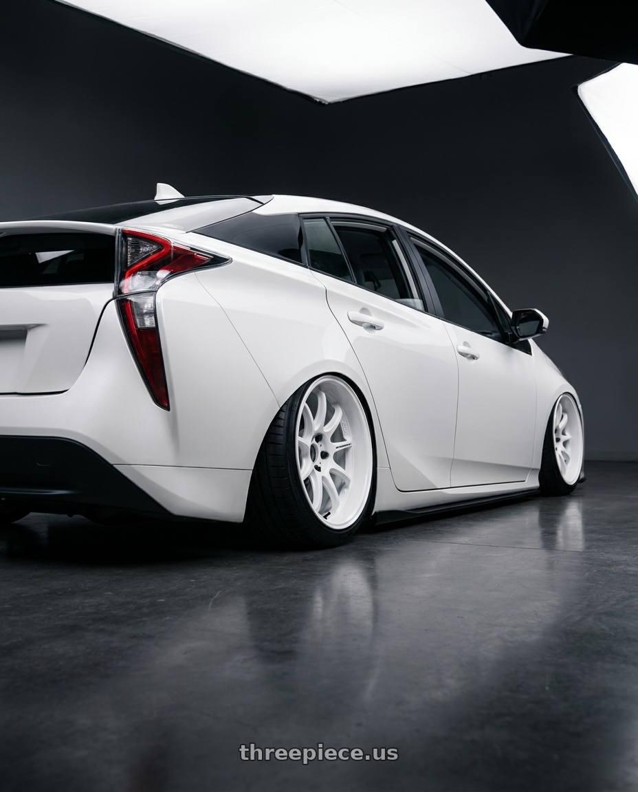 2017 toyota prius zvw 50 with Work Emotion D9r 5x100 18x10.5 +15 White wheels rear three quarter view square tires