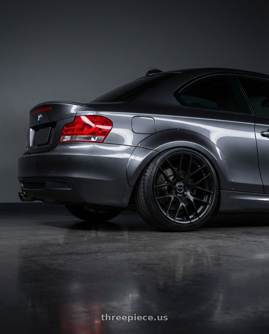 2012 BMW 1 Series E82 with Avant Garde Wheels M359 5X120 19x9 +35 Matte Black wheels rear three quarter view slight stretch tires