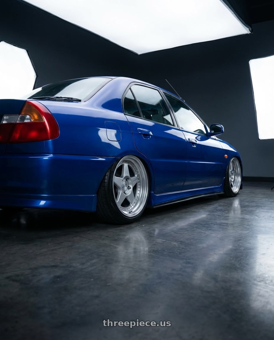 1998 Mitsubishi Lancer with Kansei K15H Astro 5x114.3 18x9 22 Hyper Silver wheels rear three quarter view slight stretch tires