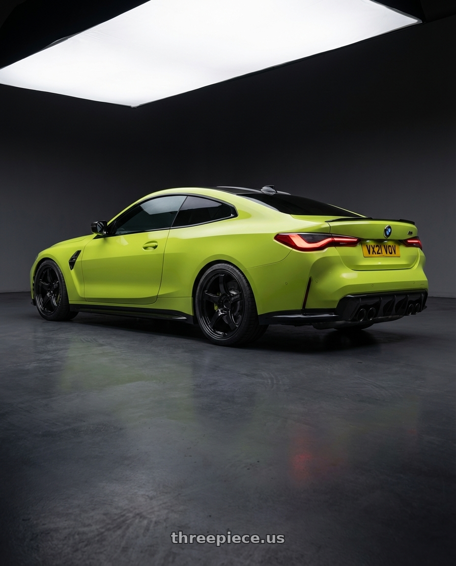 2024 BMW M4 G82 with Gram Lights 57CR 5x112 19x10.5+35 Glossy Black wheels rear three quarter view square tires